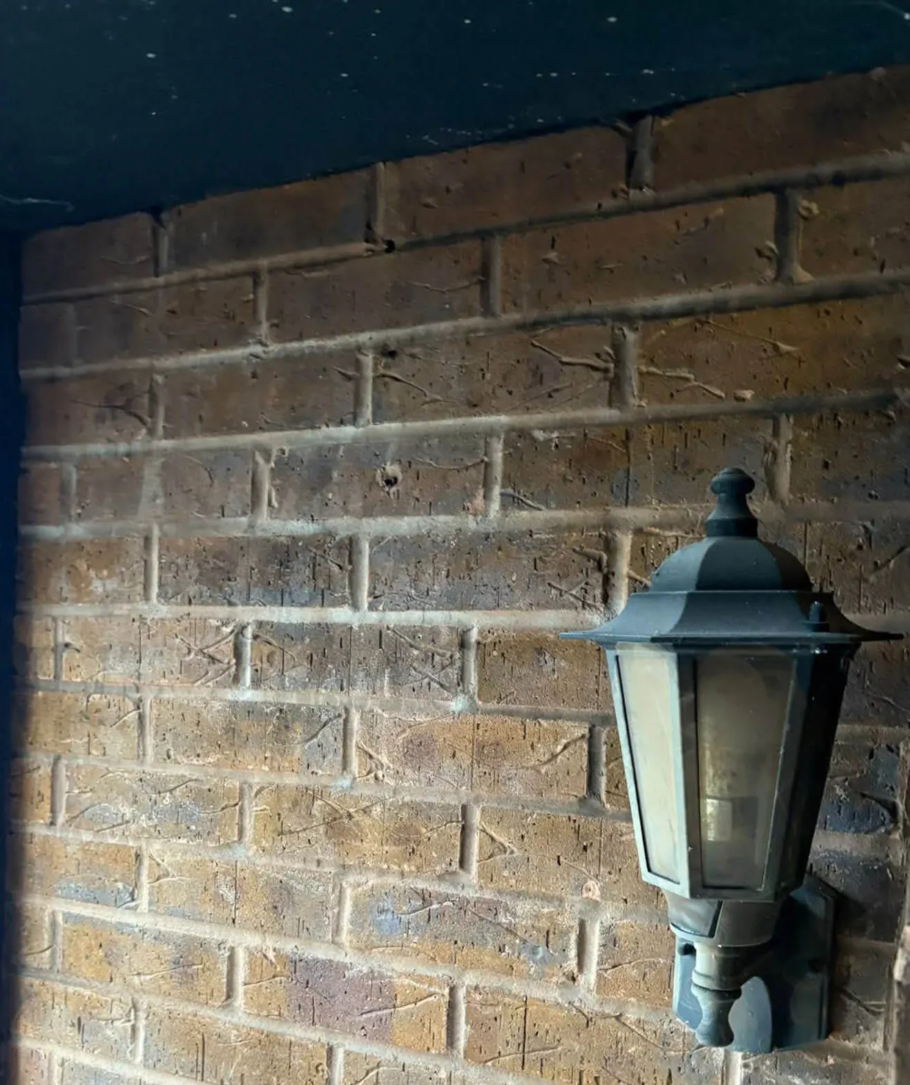 Wall surface before laser cleaning — contamination and soiling present